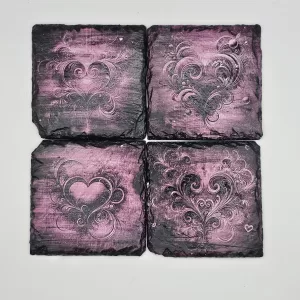 Stylized pink heart coaster set.
