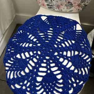 Crochet toilet lid cover.